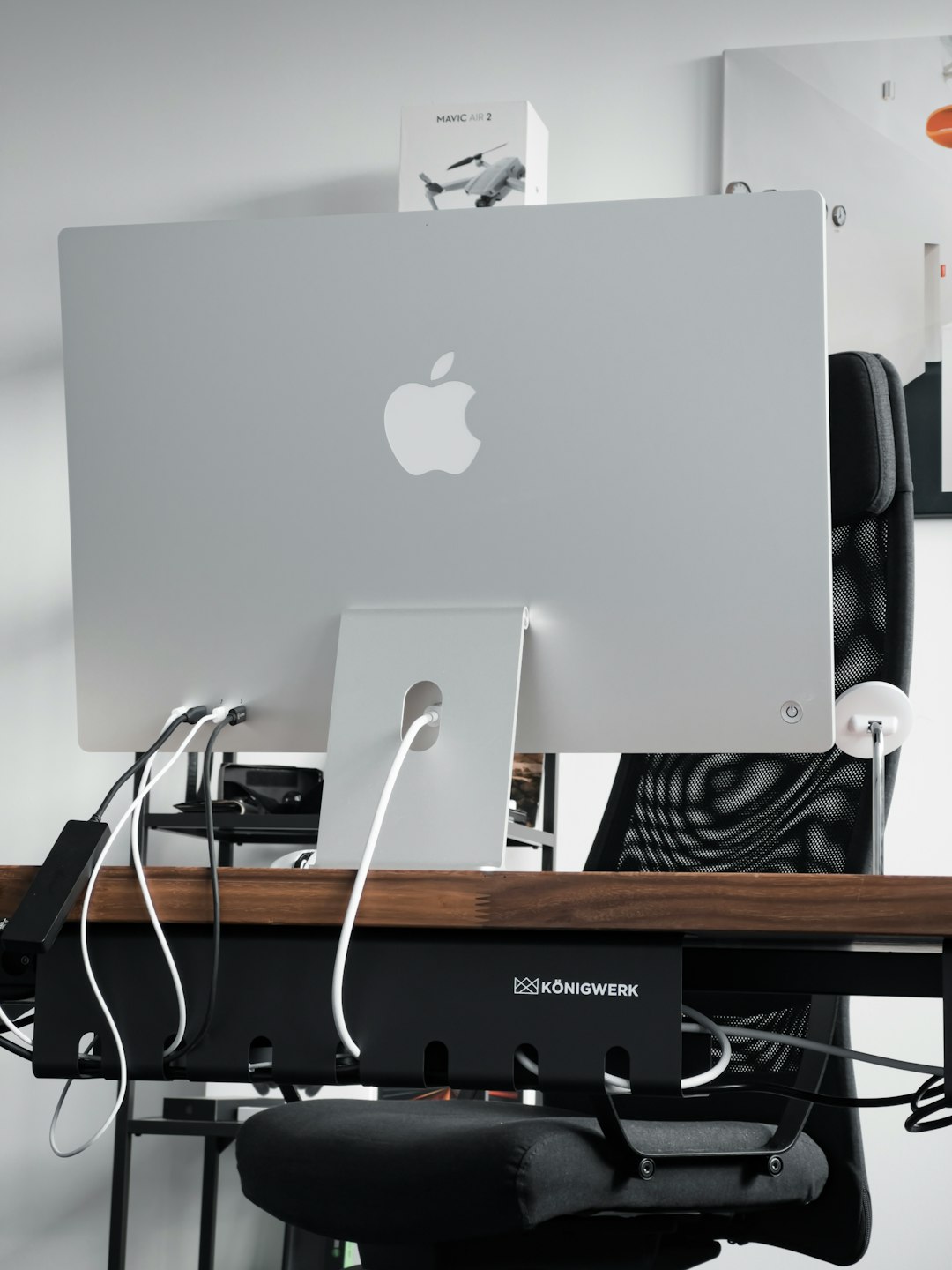 a-computer-monitor-sitting-on-top-of-a-wooden-desk-98qmwbeei4a
